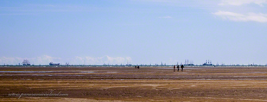 Traversing Sandymount Strand with Tall Ships on horizon