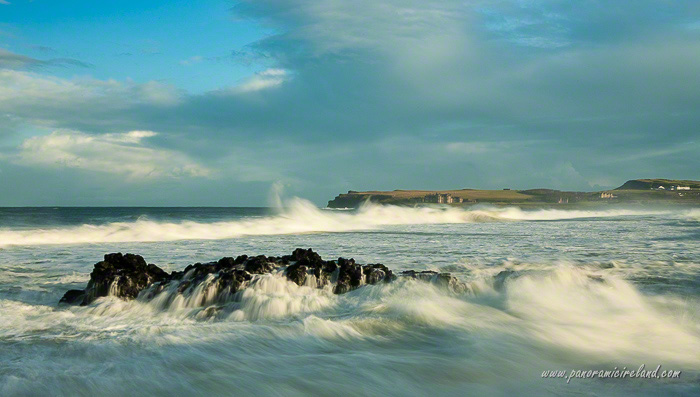 Waves crashing over rocks on the Causeway Coast of Northern Ireland