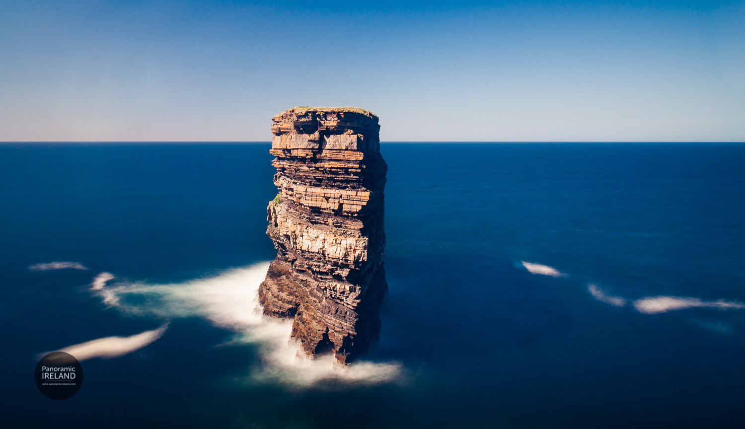 Dun Briste - alone on the Atlantic Art print of Dun Briste or Dún Briste meaning Broken Fort in Irish refers to this small but impressive vertical island on the edge of the Atlantic. In this image, layers of rocks on the stacks exposed sides hint at a sedimentary geological origin.