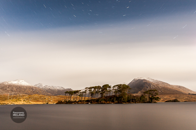 Connemara's famous Pine Island with star trails and snow