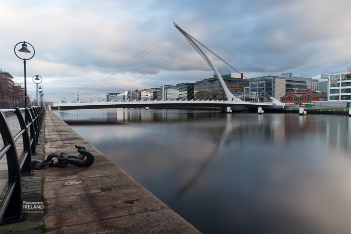 The Samuel Beckett Bridge designed by Santiago Calatrava, reflected in the River Liffey as it flows through Dublin.