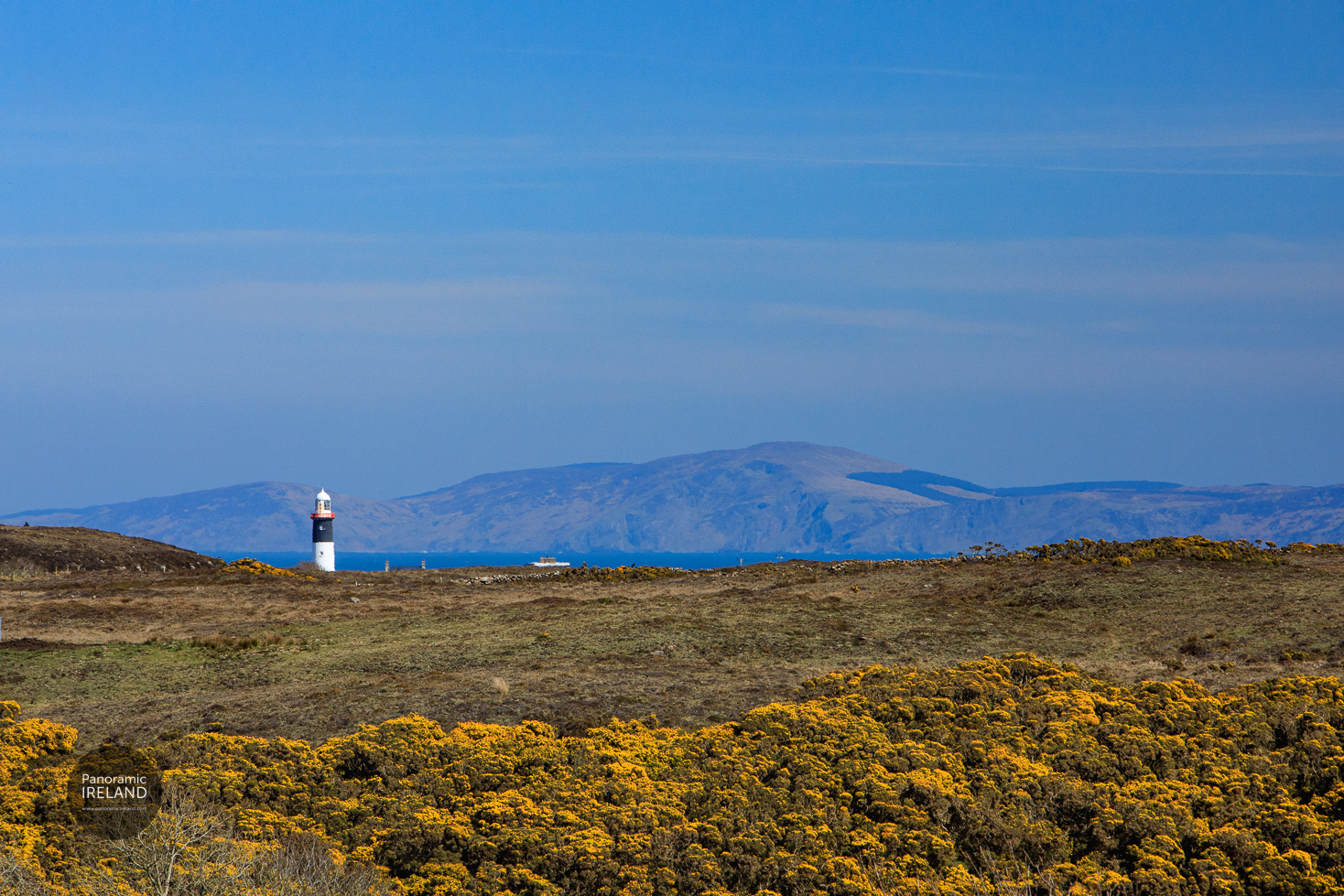 Hazy View Across Rathlin to East Lighthouse and Mull of Kintyre in Scotland Hazy View Across Rathlin to East Lighthouse and Mull of Kintyre in Scotland