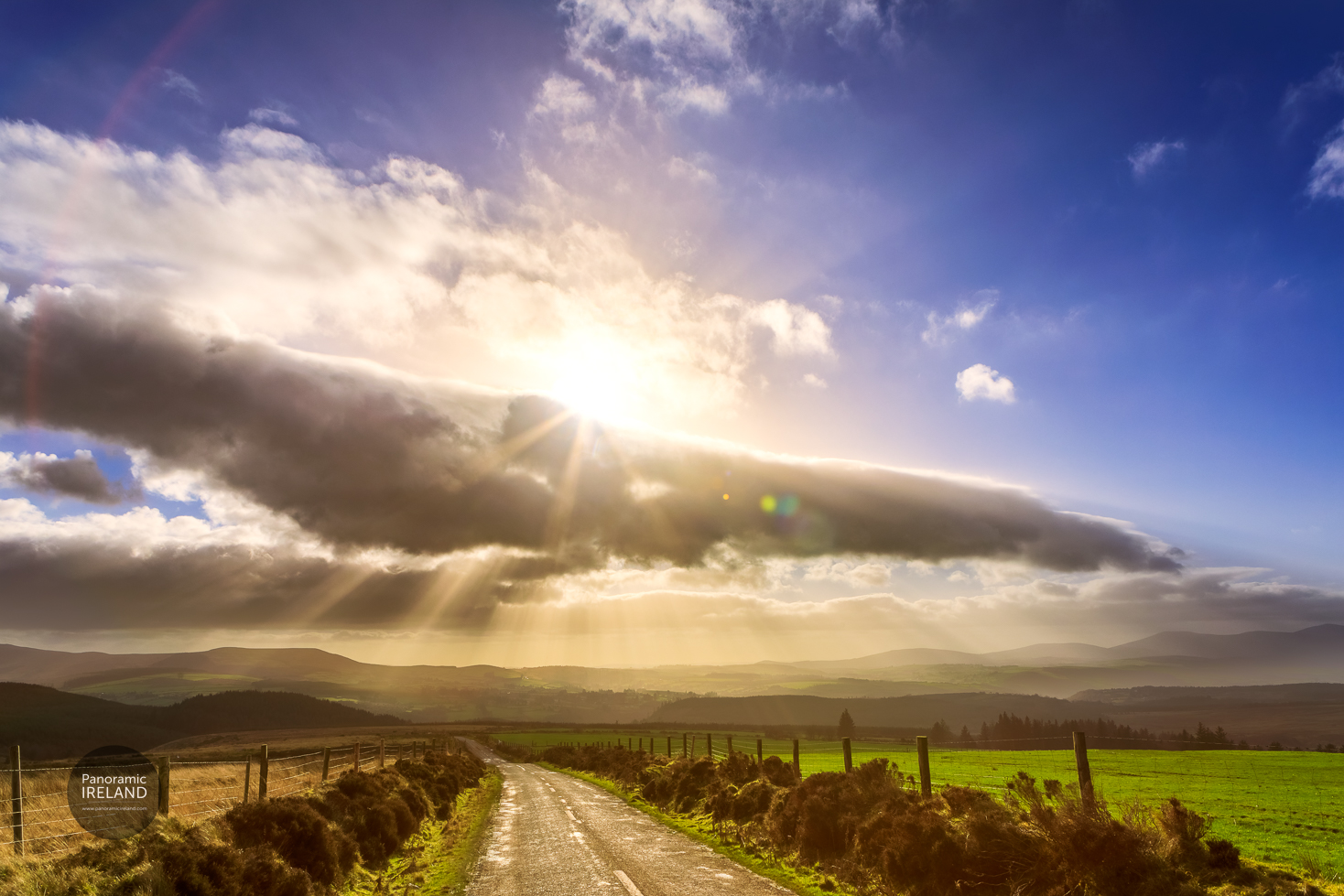 Road towards distant mountaints in Ireland on a sunny and cloudy day. Road towards distant mountaints in Ireland on a sunny and cloudy day.