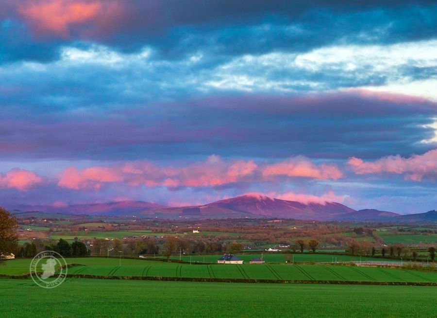 Wisping Pink Cloud over Mountains at Sunset in Ireland