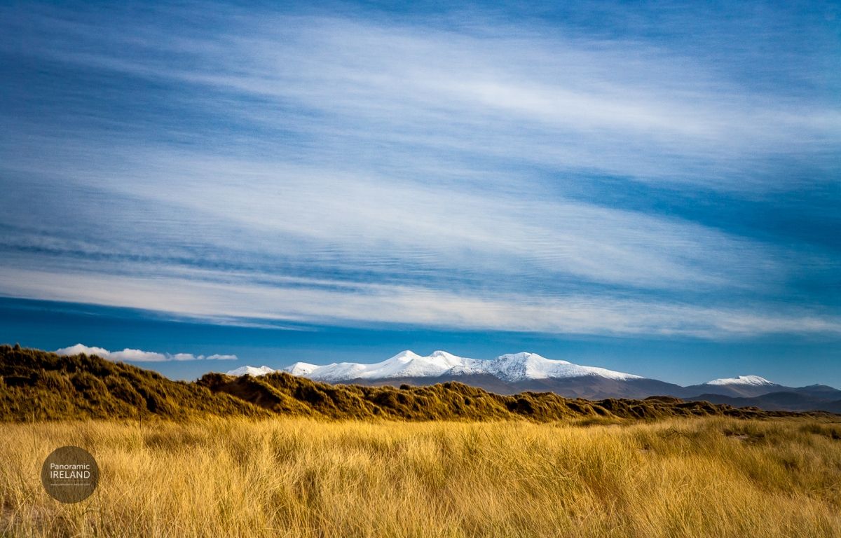 Snow, Sand Dunes and Sunshine in Winter, Carrauntoohil and MacGillycuddy&#039;s Reeks as Seen from Dingle, Ireland