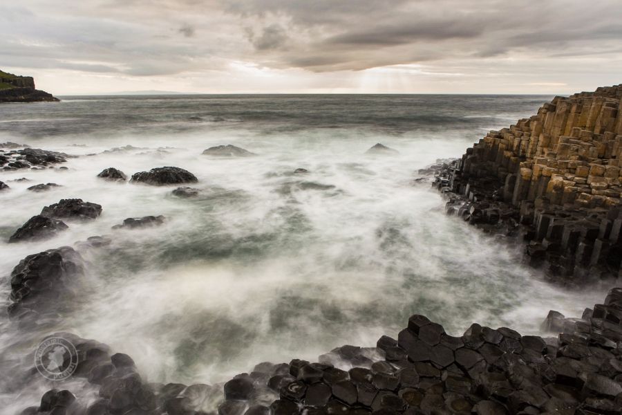 Basalt Columns and Sun Rays at the Giant&#039;s Causeway, UNESCO World Heritage Site